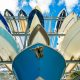 Boats stacked in a outdoor storage facility.